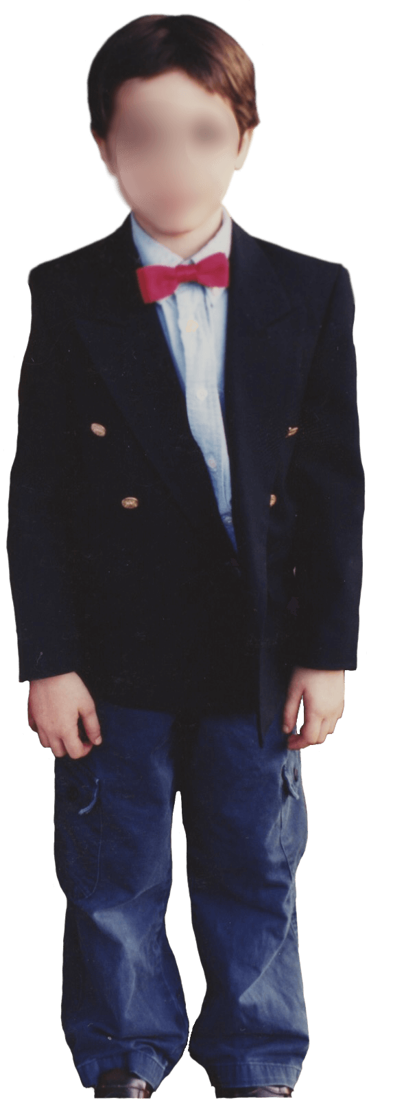 A photo of me at my brothers 5th grade graduation. I am wearing a blue button up shirt with a red bowtie, and a navy jacket on top. I also have blue pants on. My hair is short.