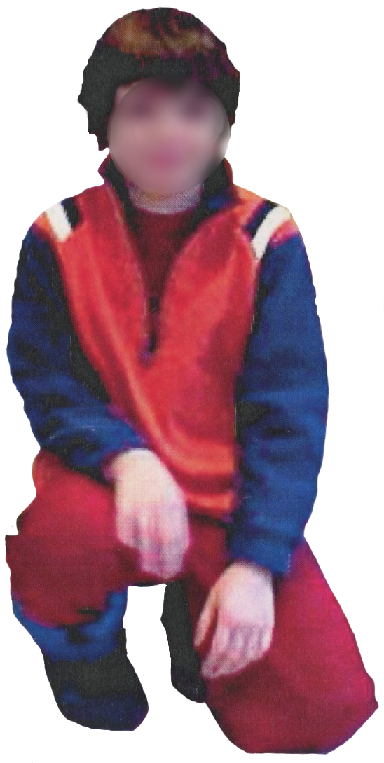 A photo of me on a 'regular day' I am wearing a red shirt with an orange and blue sweater on top. I have red sweatpants on and blue snowboots. My hair is short.
