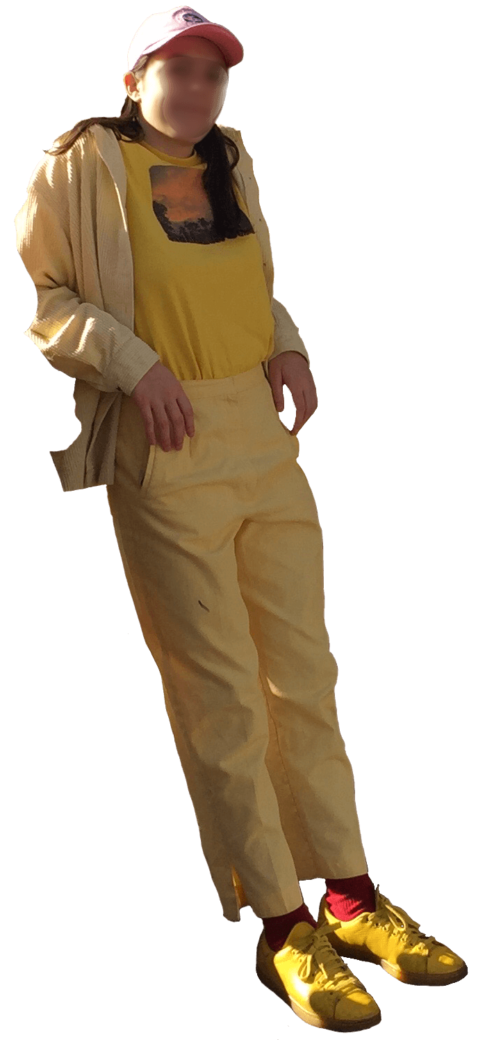 A photo of me in Las Vegas wearing all yellow except my hat (pink) and my socks (red).